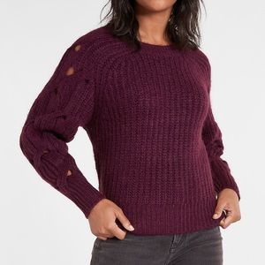 Maroon sweater with cutout sleeve details